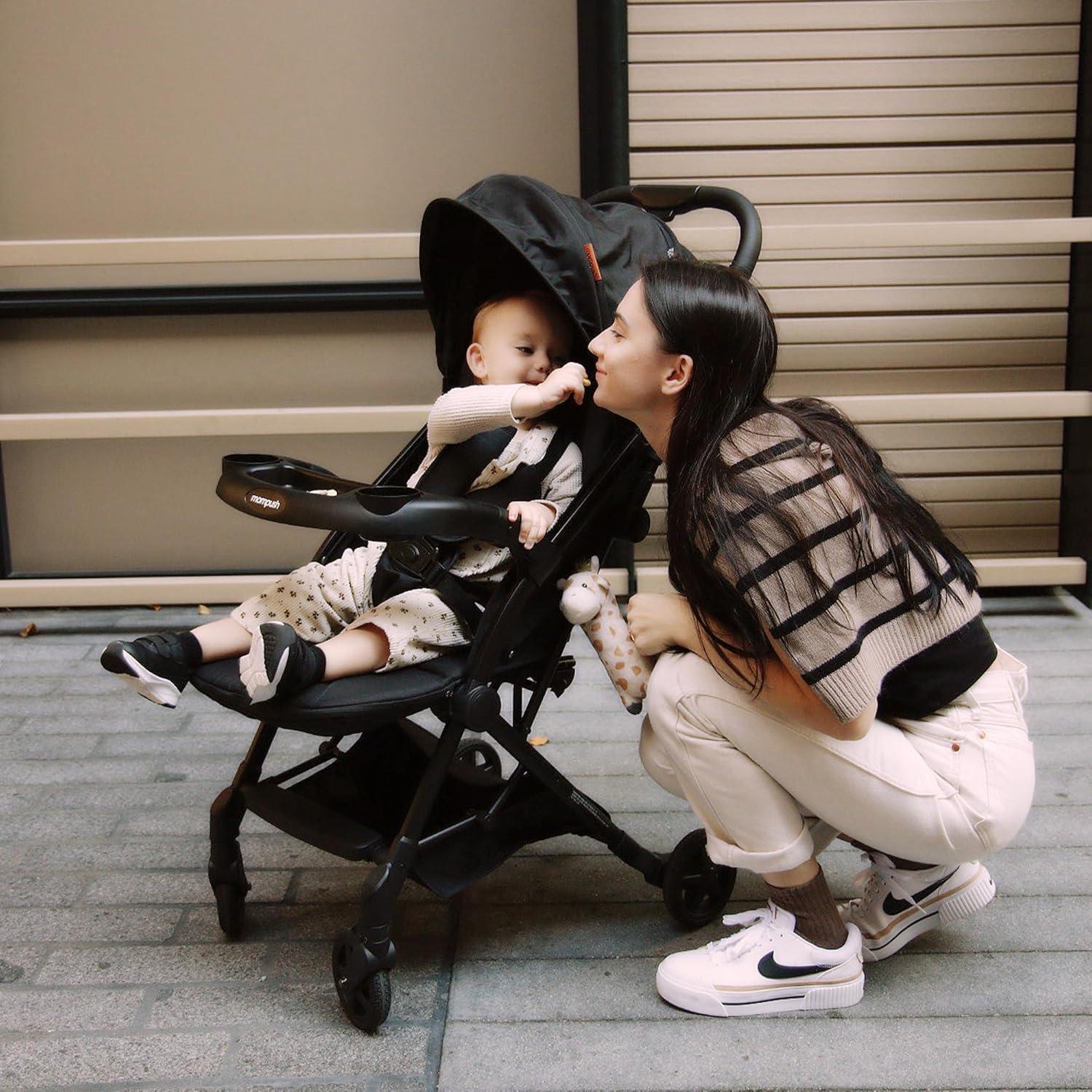 imageMompush Lithe V2 Lightweight Travel Stroller Compact Foldable Baby Stroller with Travel Bag OneHand Fold Stroller Snack Tray Mechanical Recline Seat AirplaneReady UPF 50 Canopy ampamp Rain CoverBlack